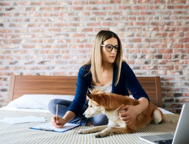 woman working from home with her dog